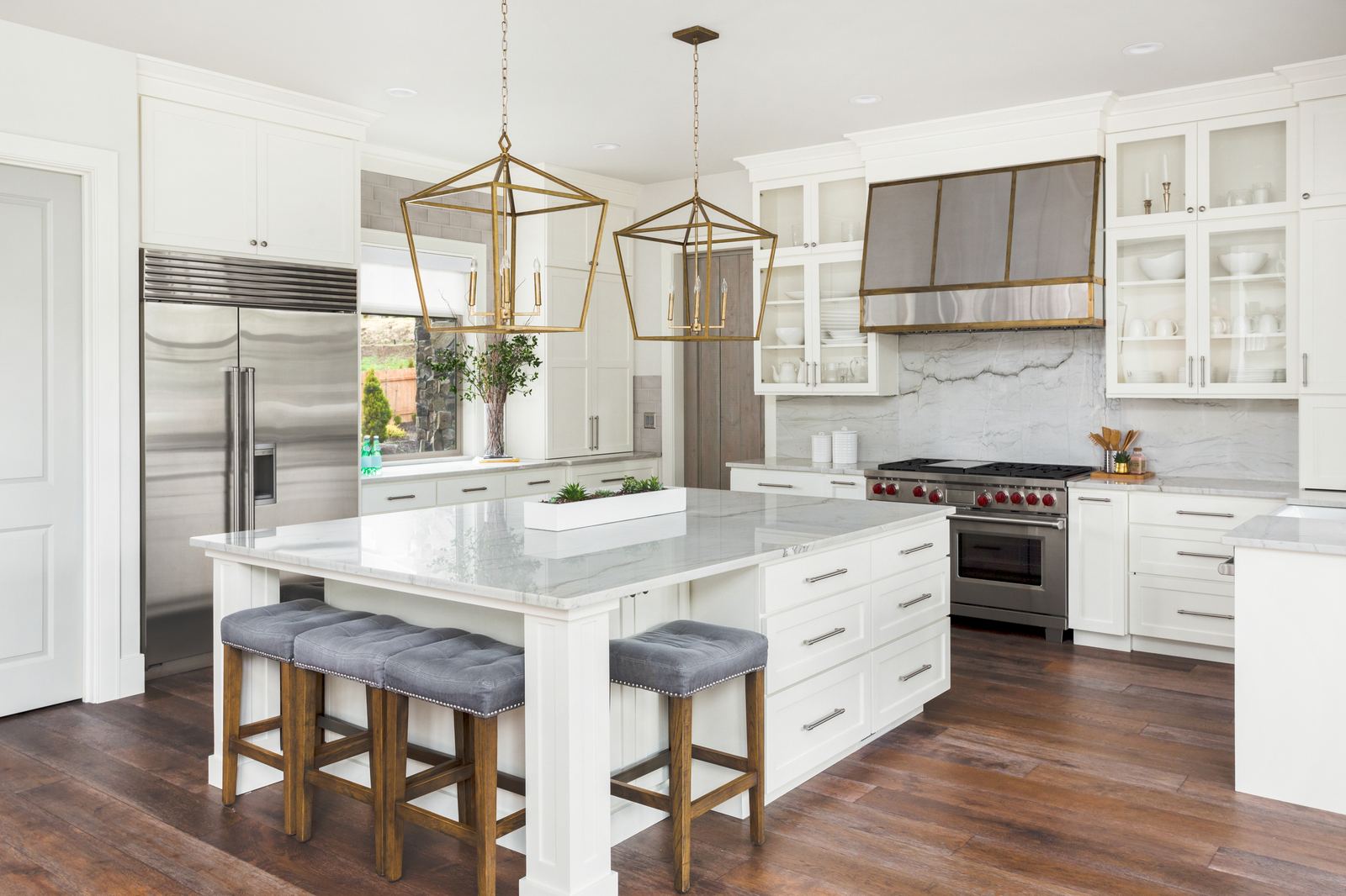 Luxury kitchen with brass pendant lighting
